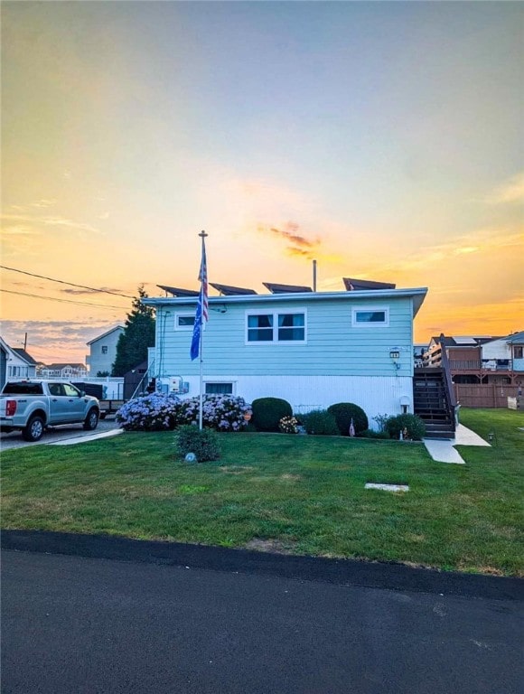 view of front of house with a yard