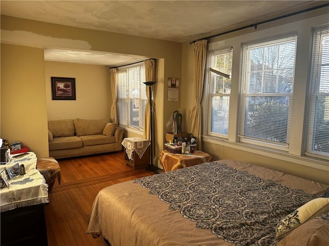 bedroom featuring wood finished floors