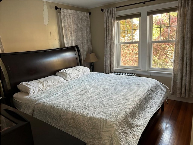 bedroom featuring dark wood-style floors