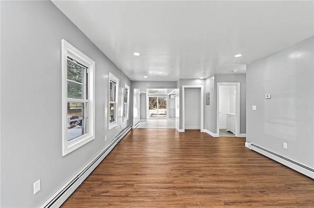 interior space featuring dark hardwood / wood-style flooring and baseboard heating