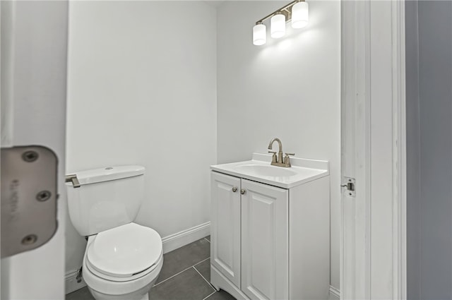 bathroom with tile patterned floors, vanity, and toilet