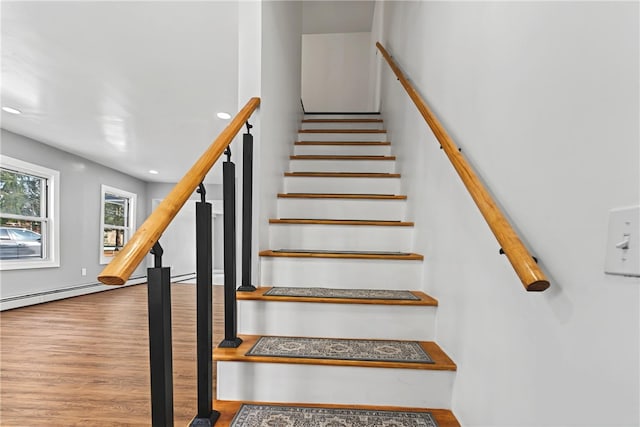 stairs featuring wood-type flooring