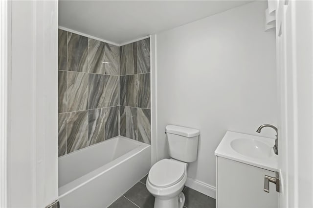 full bathroom featuring tile patterned floors, toilet, tiled shower / bath combo, and vanity