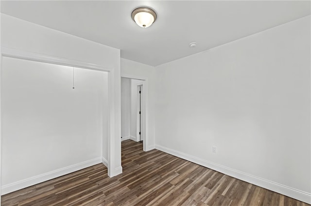 spare room featuring dark hardwood / wood-style floors