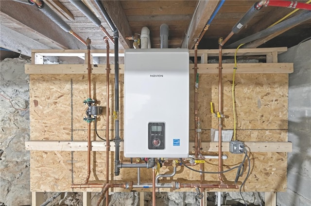 utility room featuring water heater