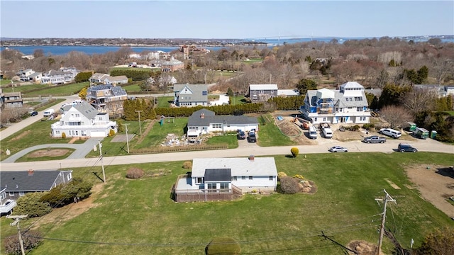 birds eye view of property featuring a residential view and a water view