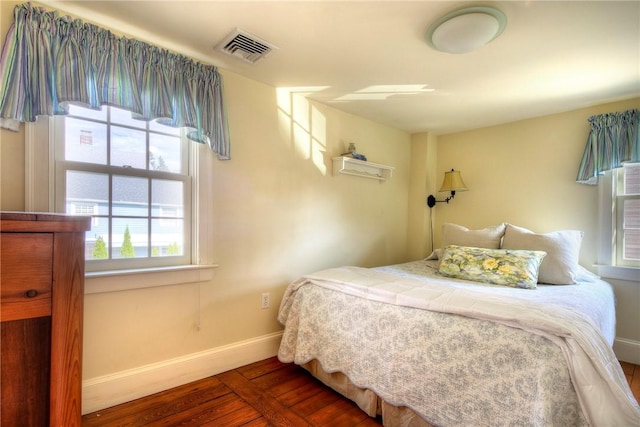 bedroom with dark wood-type flooring