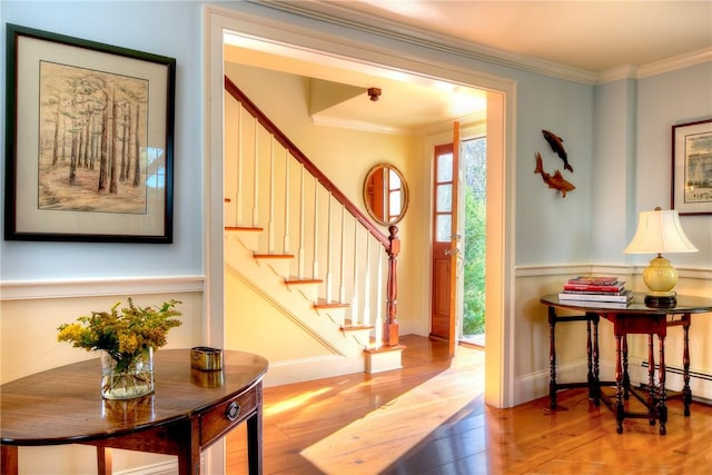 interior space featuring crown molding and light hardwood / wood-style floors