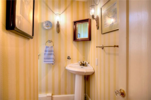 bathroom with a baseboard heating unit