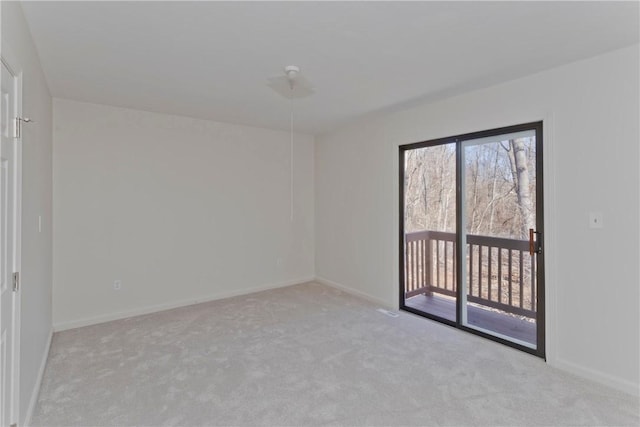 spare room with carpet floors and baseboards