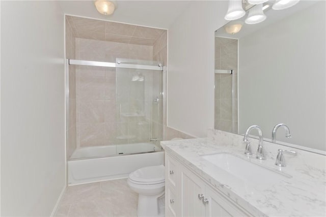 full bathroom featuring toilet, enclosed tub / shower combo, baseboards, and vanity