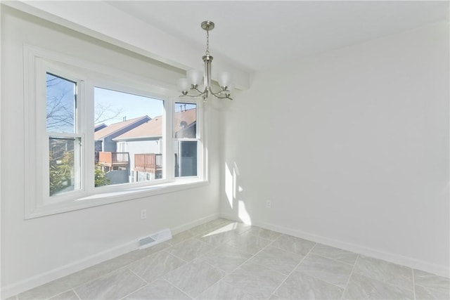 unfurnished dining area featuring beam ceiling, visible vents, baseboards, and an inviting chandelier