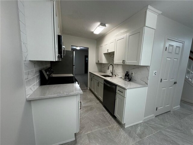 kitchen with electric stove, dishwasher, marble finish floor, light countertops, and a sink