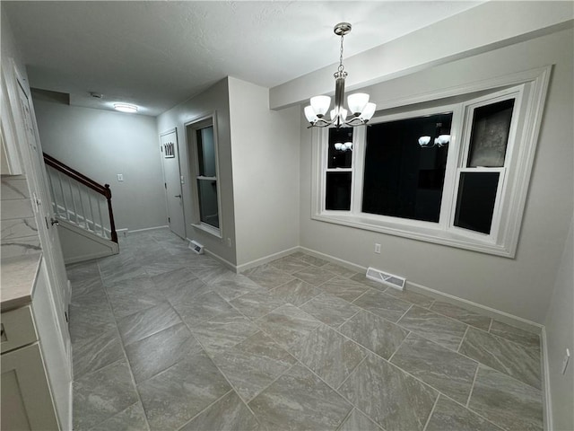 unfurnished dining area featuring baseboards, stairs, visible vents, and a chandelier