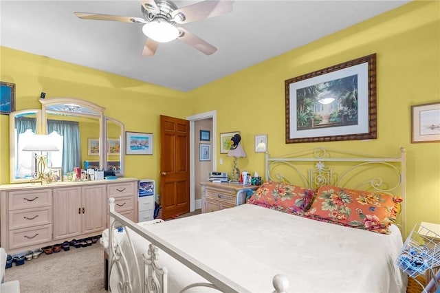 carpeted bedroom with a ceiling fan