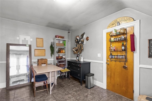 tiled dining space with baseboards