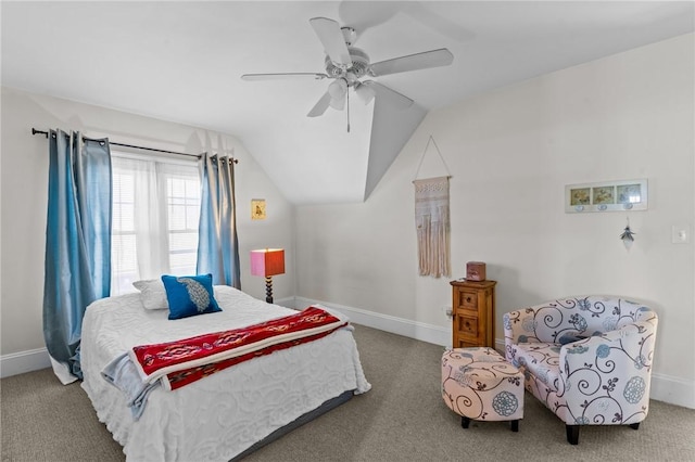 carpeted bedroom with vaulted ceiling, a ceiling fan, and baseboards