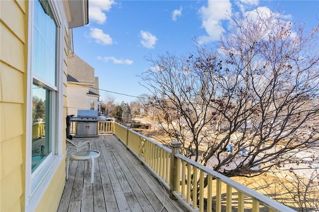 wooden terrace with area for grilling