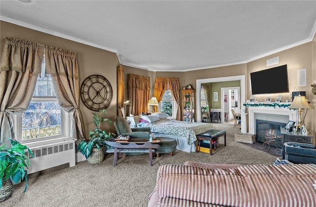 living room featuring a fireplace with flush hearth, carpet flooring, crown molding, and radiator heating unit