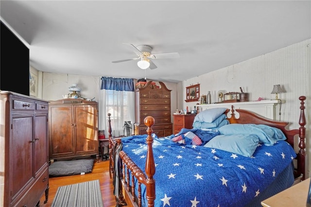 bedroom featuring a ceiling fan and wood finished floors