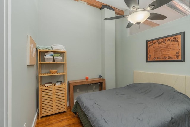 bedroom with ceiling fan and hardwood / wood-style floors