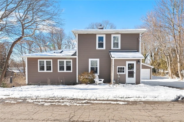 view of front of house featuring a detached garage