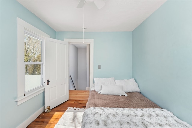 bedroom featuring light wood-style floors and ceiling fan