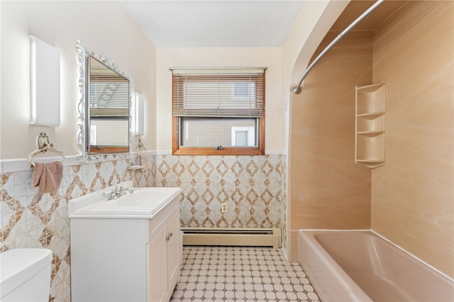 full bathroom featuring shower / bath combination, toilet, a baseboard radiator, tile walls, and vanity