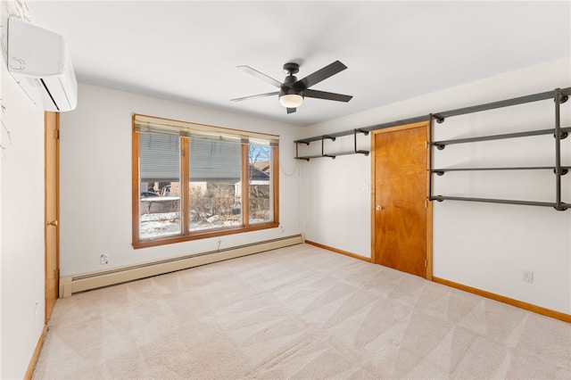 carpeted empty room featuring a baseboard radiator, a wall mounted AC, and ceiling fan