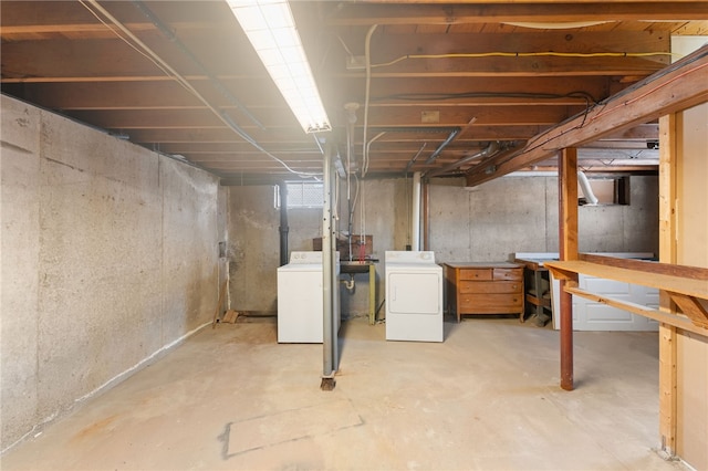 basement featuring washing machine and clothes dryer