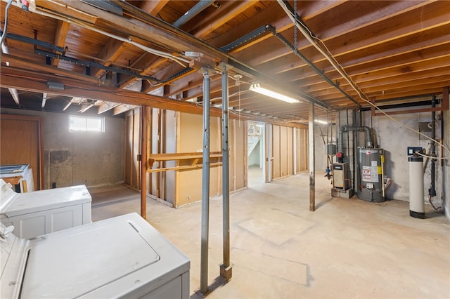 basement featuring separate washer and dryer and gas water heater