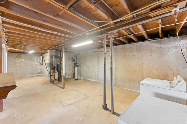 basement with independent washer and dryer and gas water heater