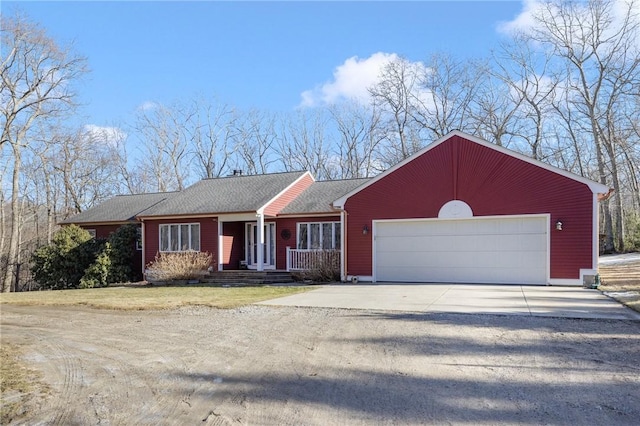 view of front of house featuring a garage and concrete driveway