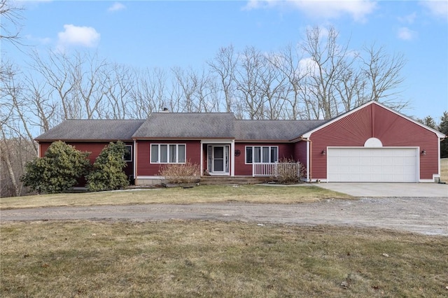 ranch-style home with concrete driveway, an attached garage, and a front lawn