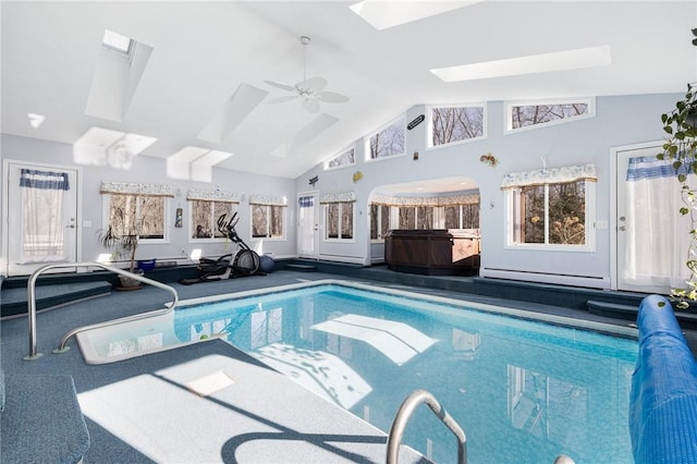 indoor pool featuring a skylight and a ceiling fan