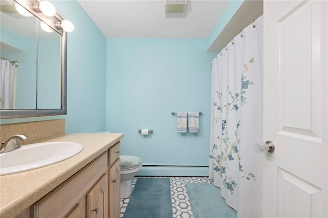 bathroom with toilet, vanity, and baseboard heating