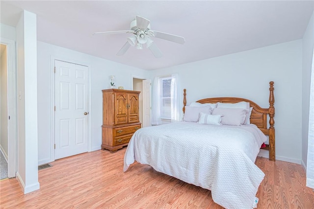 bedroom with ceiling fan and light hardwood / wood-style flooring