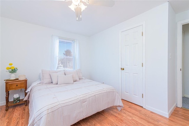 bedroom featuring ceiling fan and light hardwood / wood-style flooring