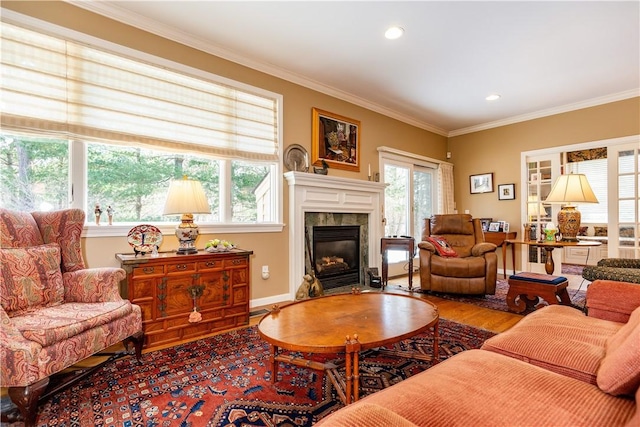 living room featuring hardwood / wood-style flooring and crown molding