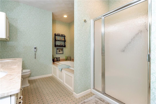 full bathroom featuring toilet, vanity, tile patterned flooring, and independent shower and bath