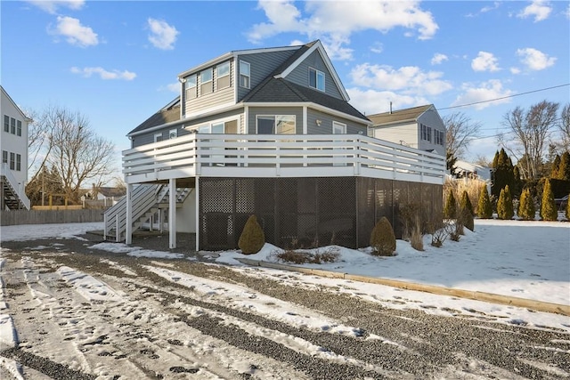 view of front of house with a wooden deck