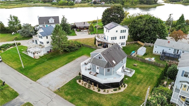 birds eye view of property featuring a water view and a residential view