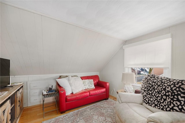 living room with lofted ceiling and light hardwood / wood-style floors