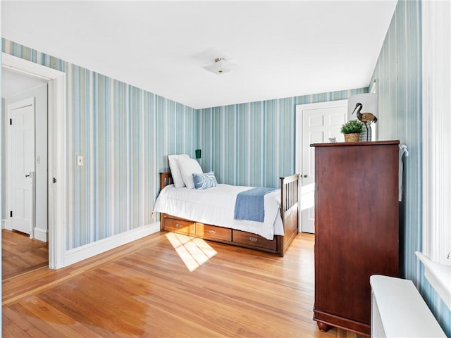 bedroom with light hardwood / wood-style flooring