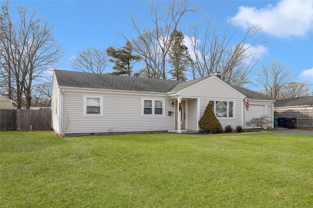 ranch-style home with a front lawn and a garage