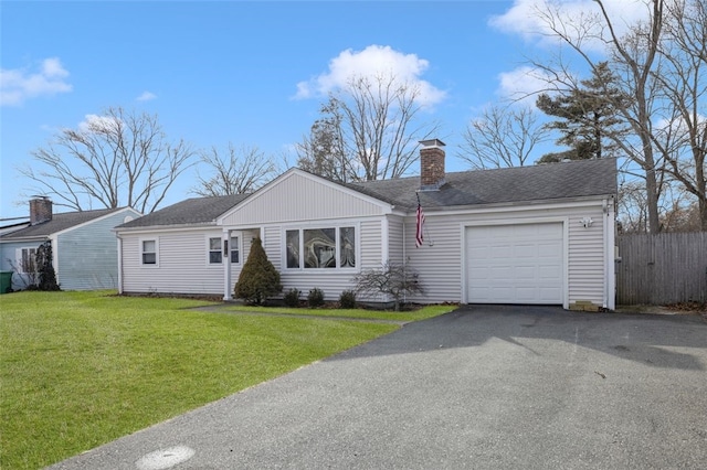 ranch-style home with a front lawn and a garage