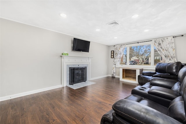 living room featuring ornamental molding and dark wood-type flooring