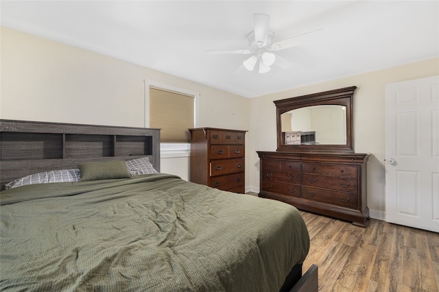 bedroom featuring ceiling fan and wood-type flooring