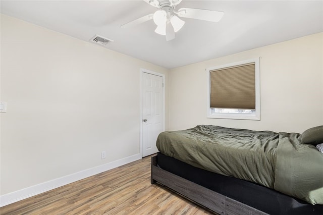 bedroom with ceiling fan and light wood-type flooring