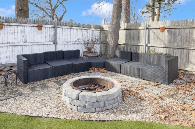 view of patio featuring an outdoor living space with a fire pit